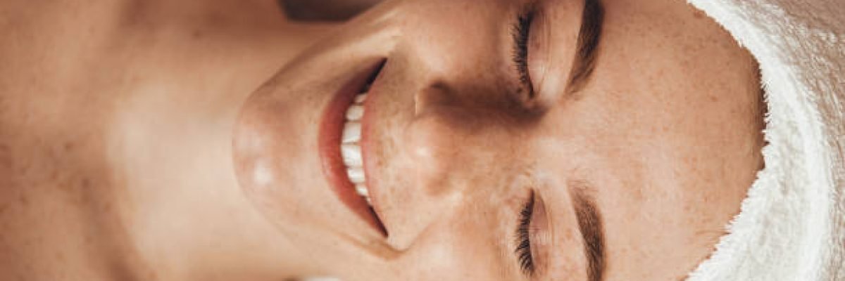Freckled woman face receiving mesotherapy injection with derma pen on face for rejuvenation on the spa salon. Beauty woman face skin care. Health care, beauty treatment. Professional beauty salon.